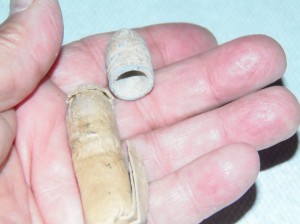 A Minie cartridge with a Minie bullet shown separately
